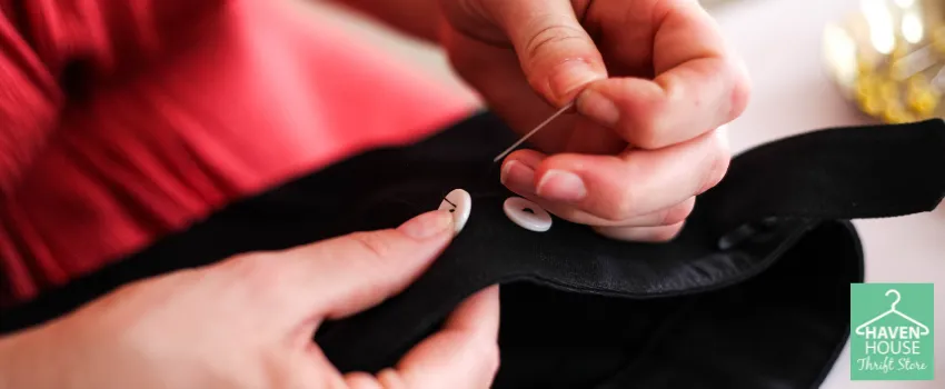 HHTS - Person Sewing a Button into a Shirt