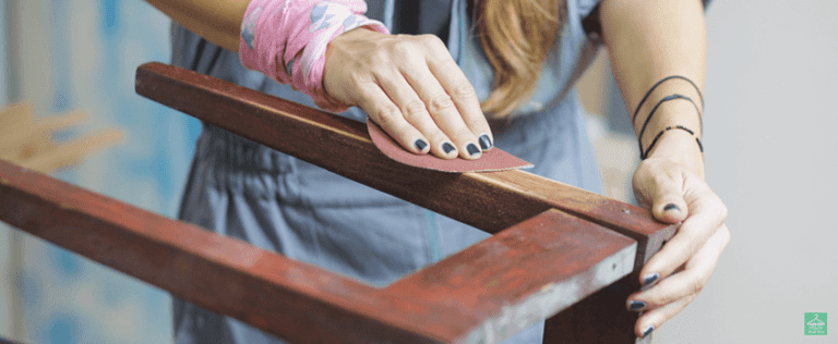 HHTS-detail of woman restoring furniture